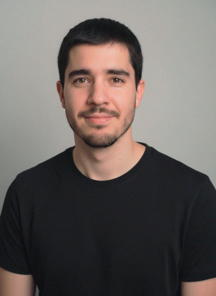 A professional headshot of Conrado Torres.